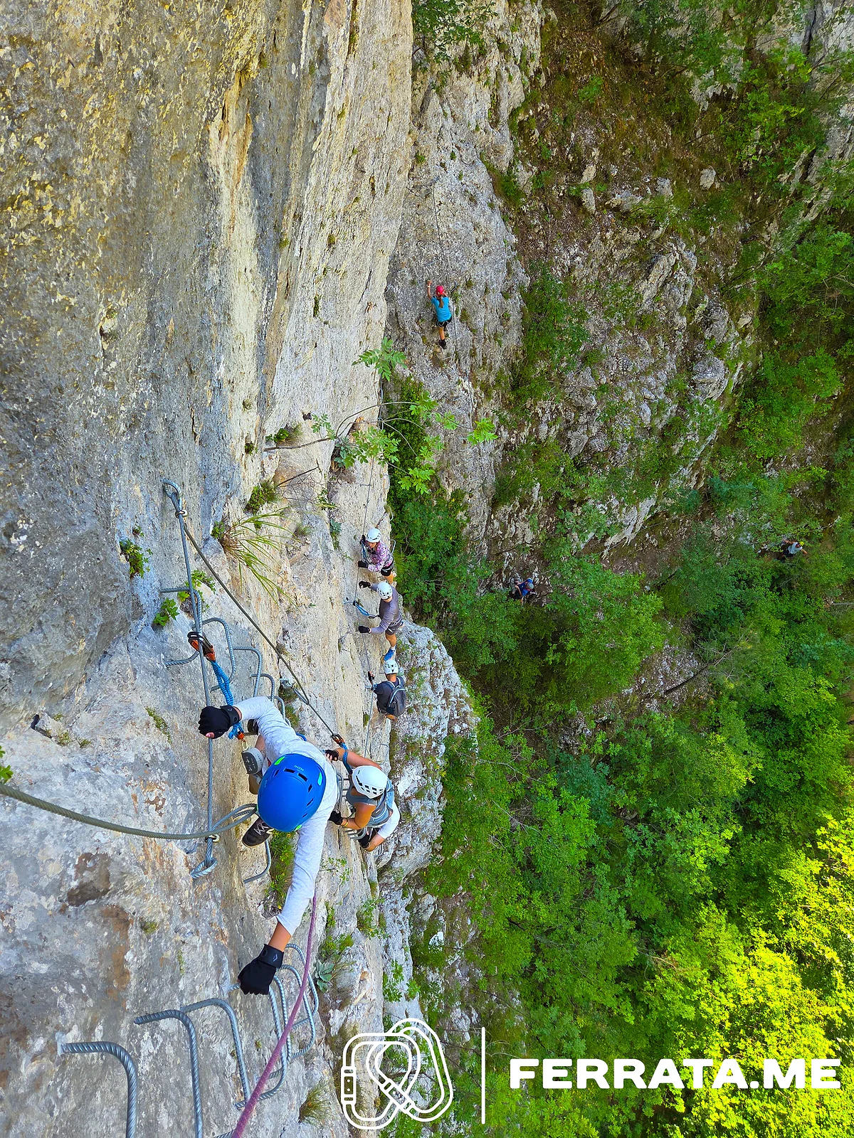 Looking down at a climber on the vertical wall.